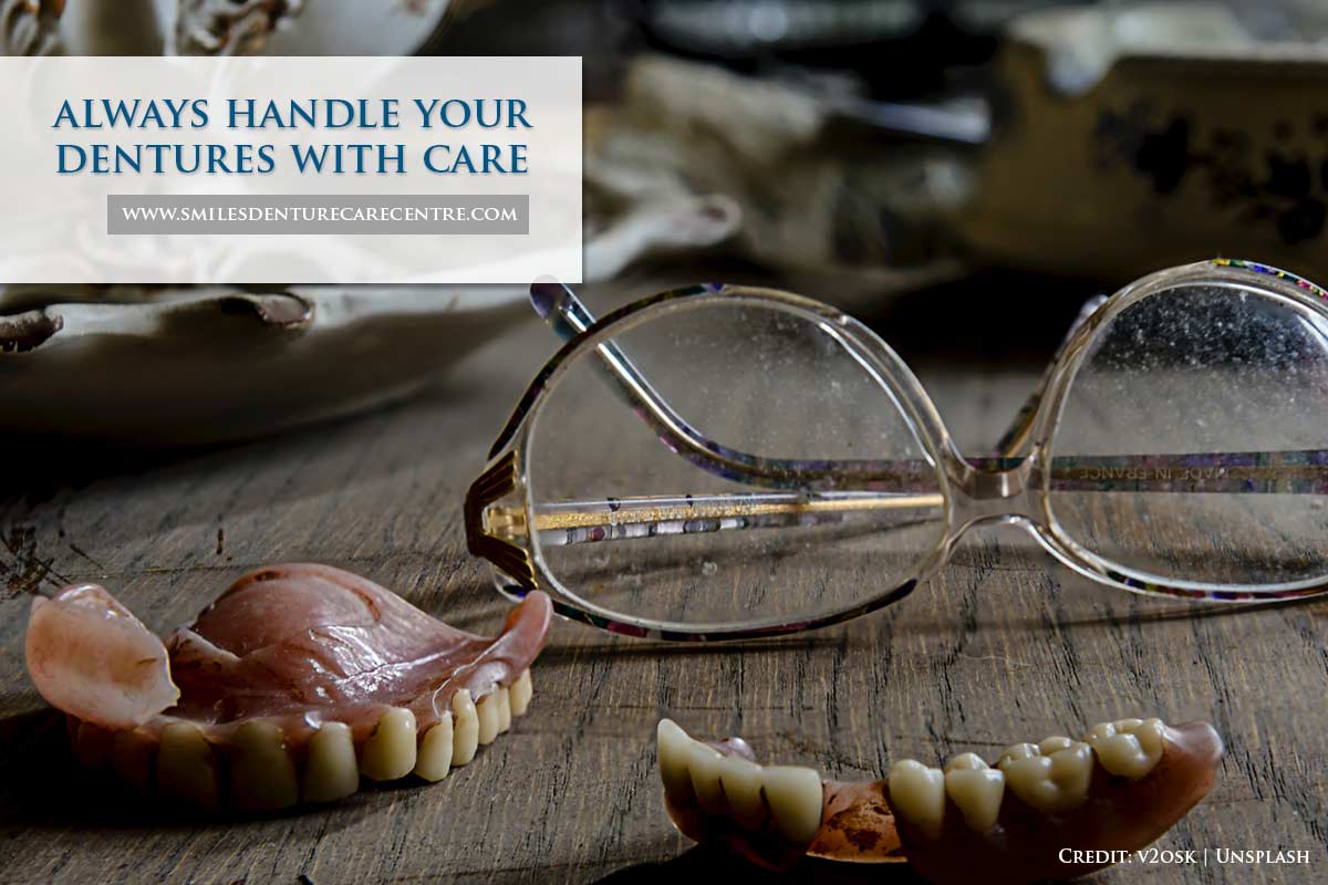 always handle your dentures with care